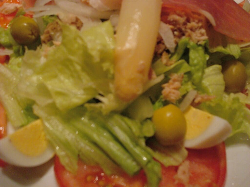 A salad on a white plate.