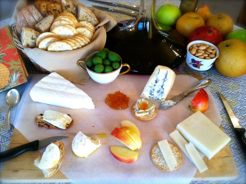 A platter of cheese and crackers on a table.
