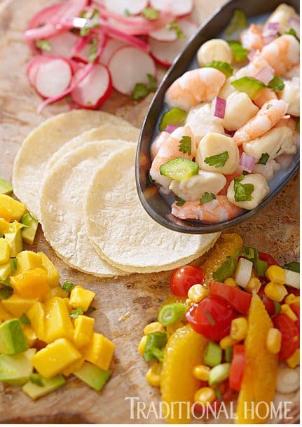 Traditional home shrimp tacos with mango and radishes.