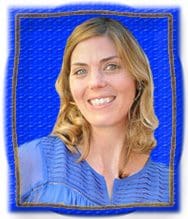 An image of a woman smiling in a blue frame.