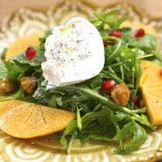 Persimmon and burratta salad with pomegranates and goat cheese.